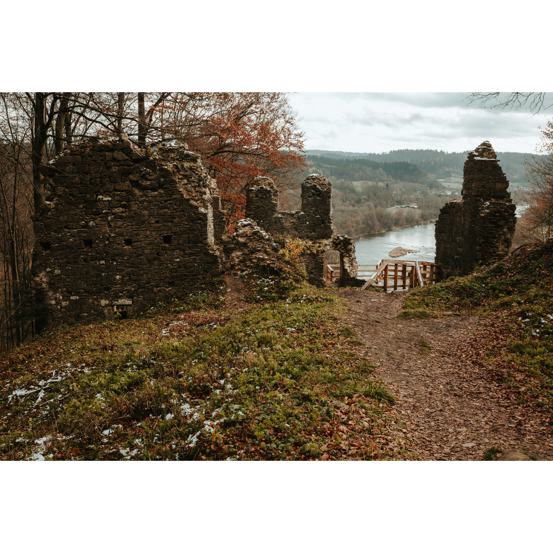 Stone ruins of the castle overlooking the water reservoir