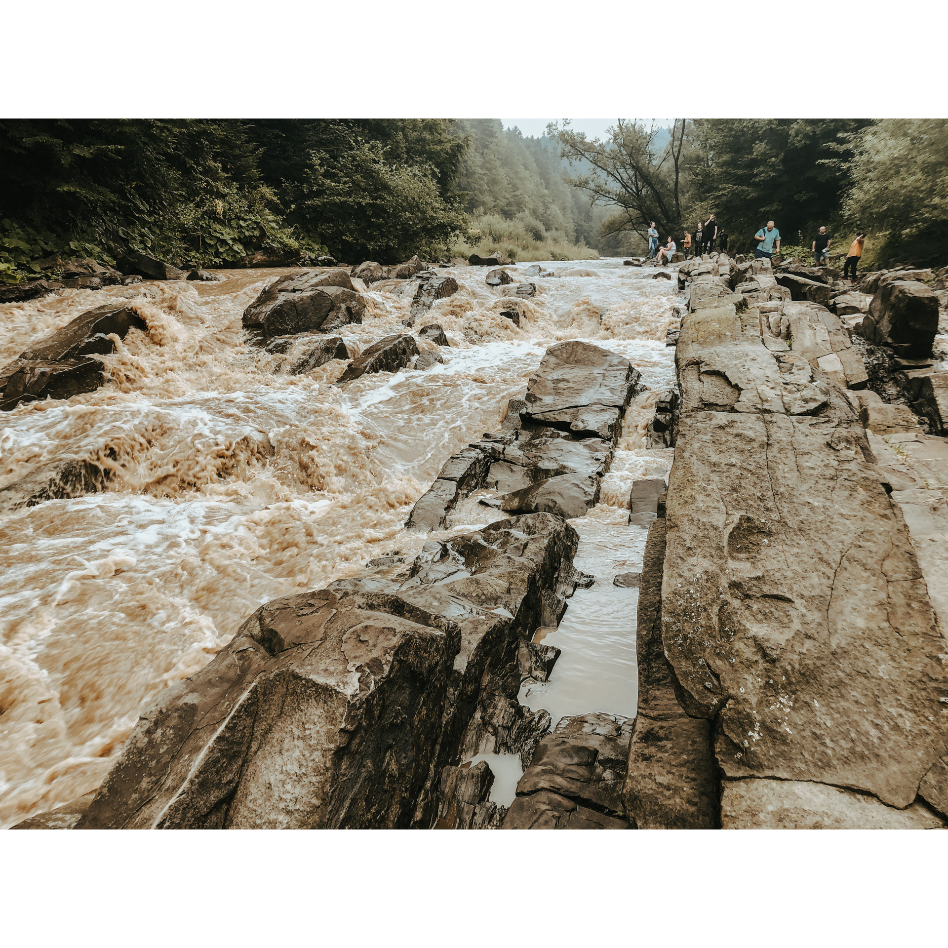 The rough current of the river hitting the stones