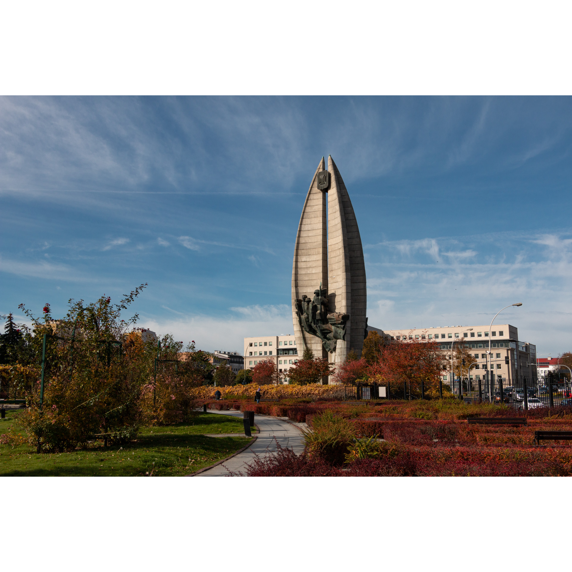 View of the concrete tall monument with a metal sculpture and the emblem of Rzeszów