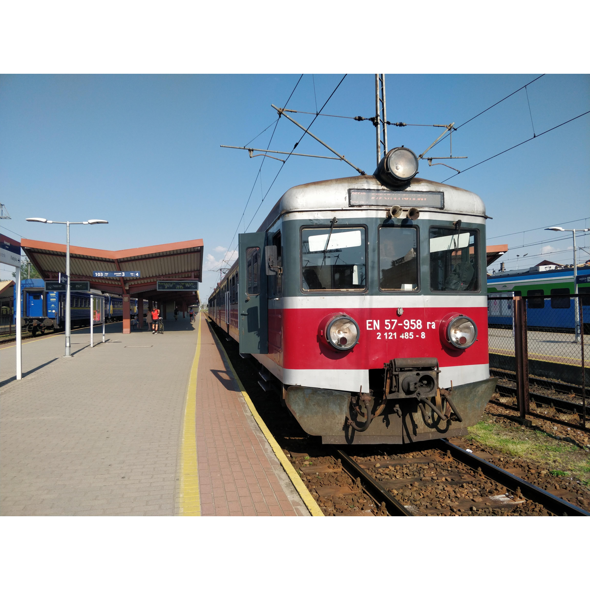 Silver and red train at the railway station