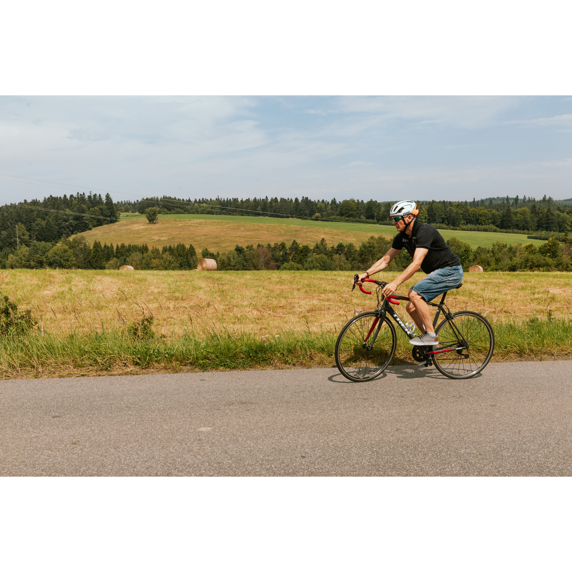 Cyclist against the background of the field