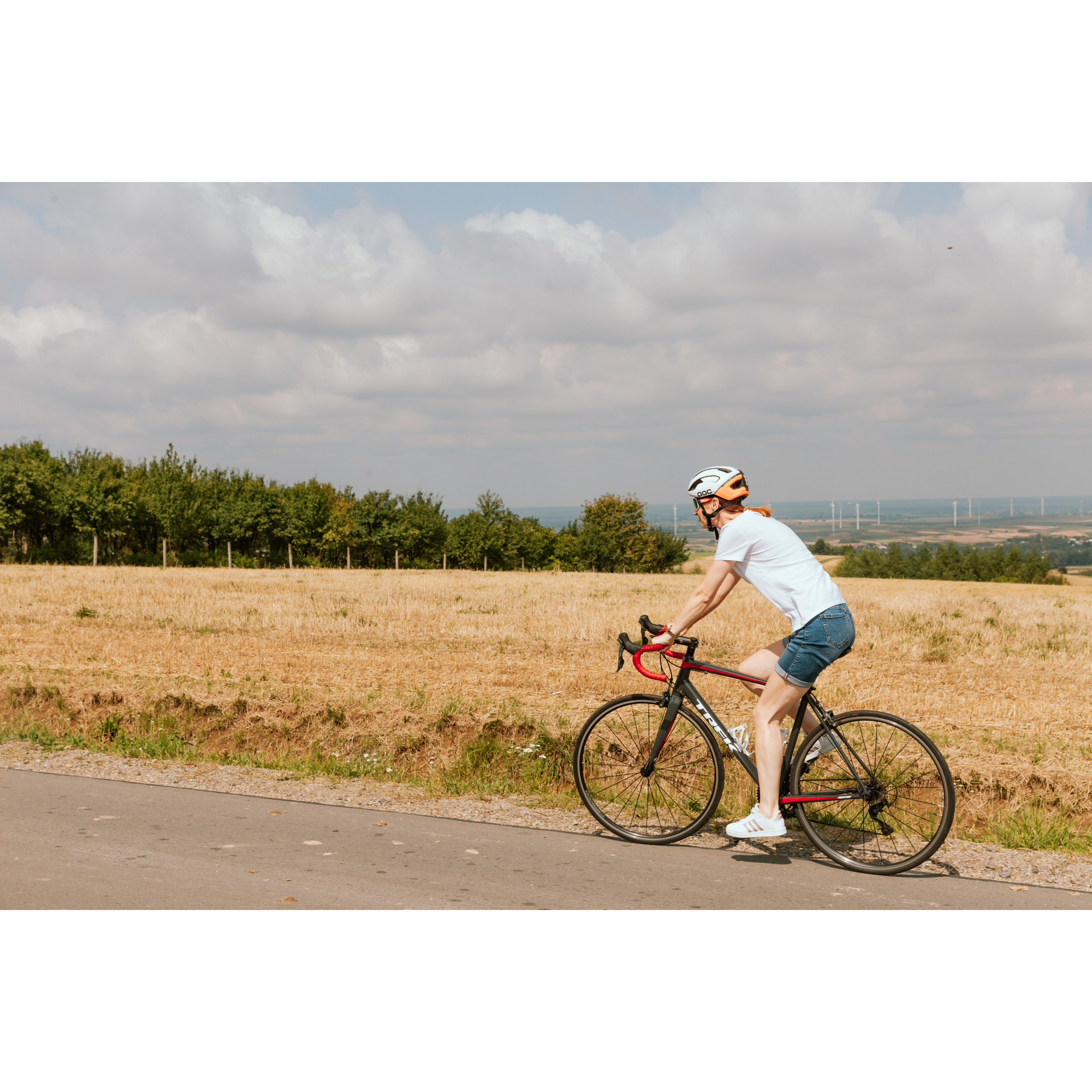 A cyclist against the background of a clearing