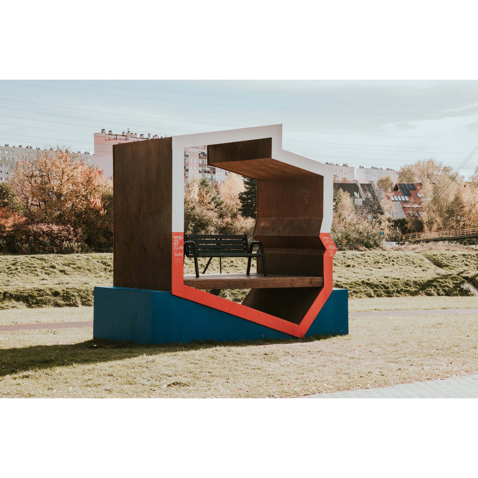 A bench on a platform in the shape of Poland