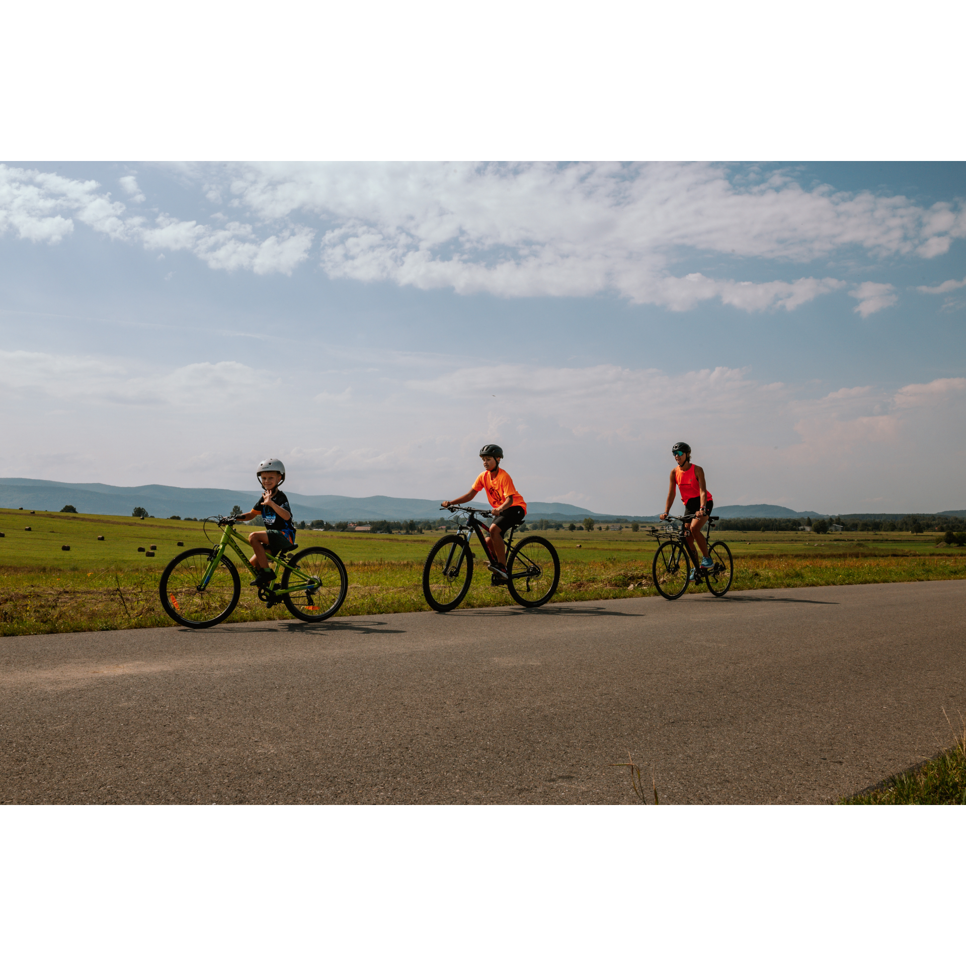 Cyclists and fields in the background