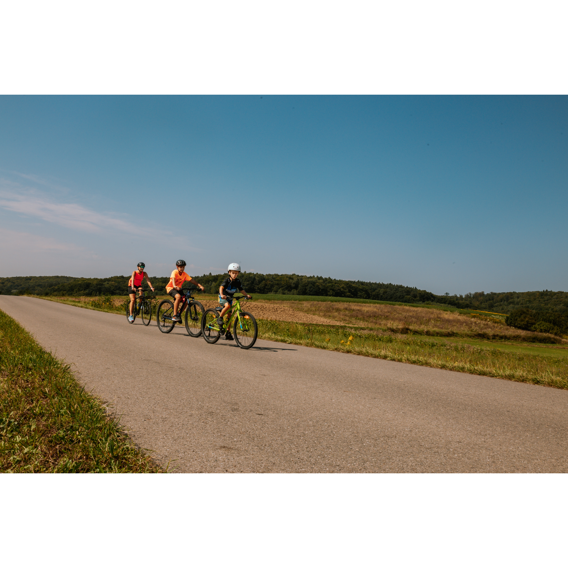 Cyclists in an open field