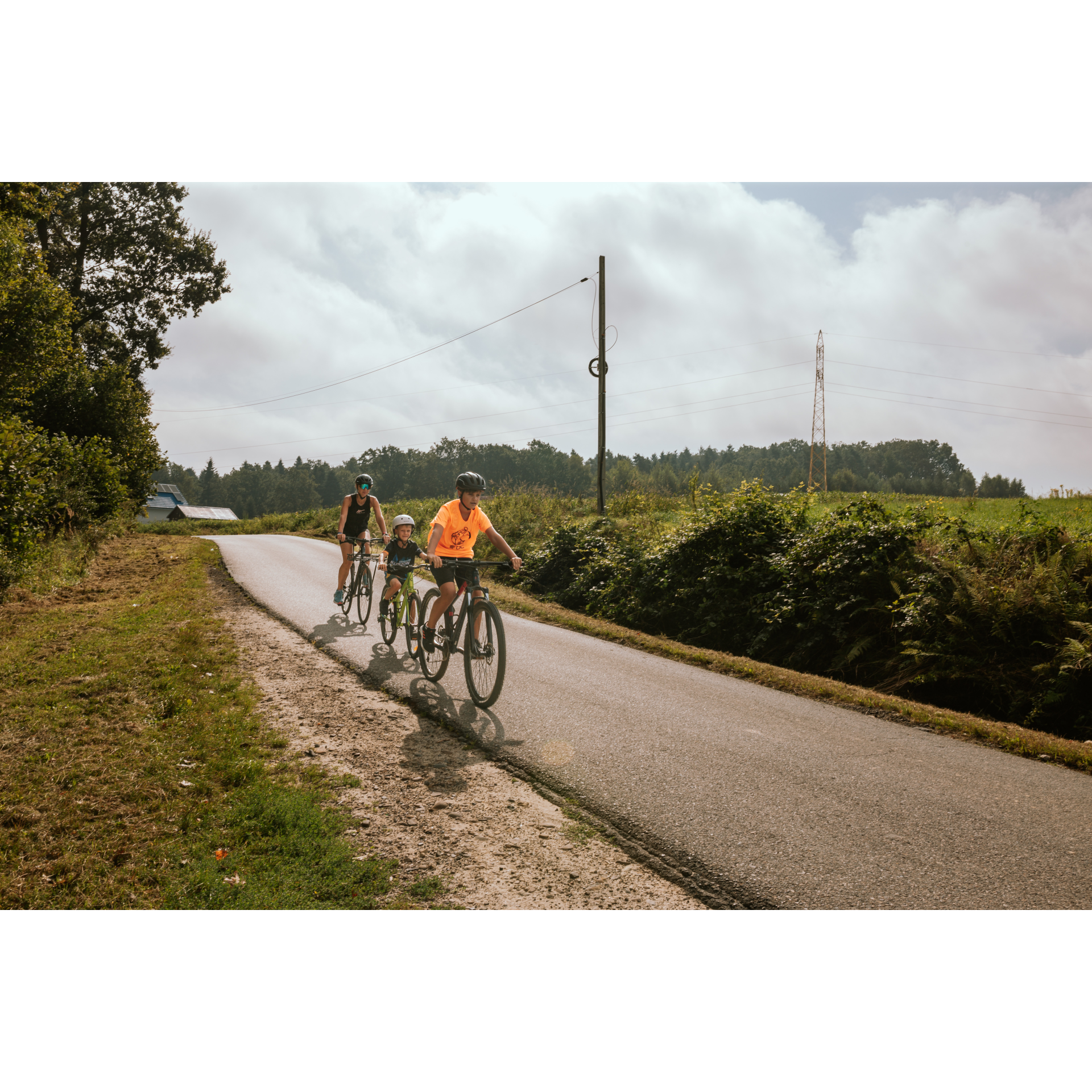 Cyclists on a narrow road