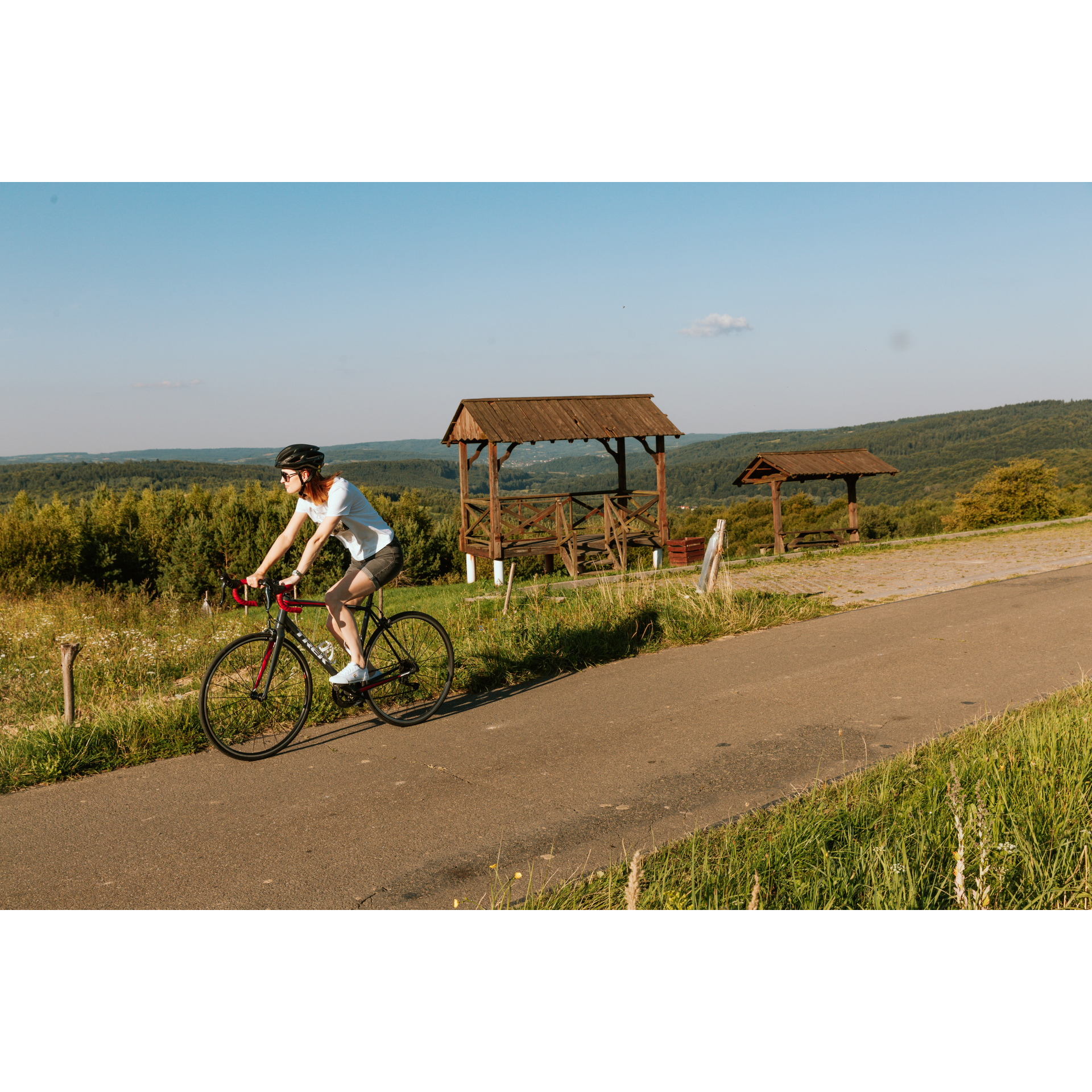 A cyclist at a wooden booth