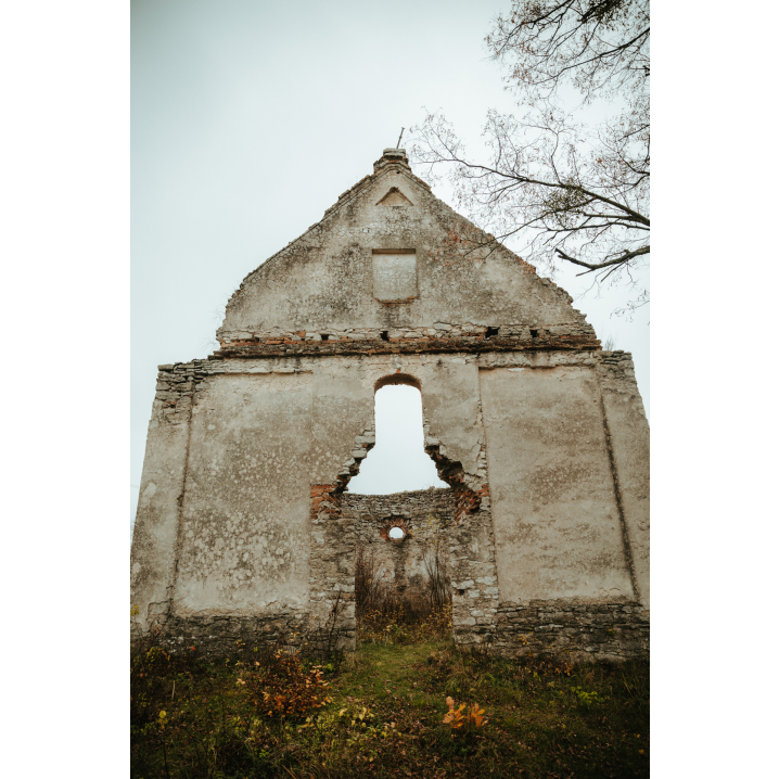 Entrance to the ruins of the church without a roof and a door