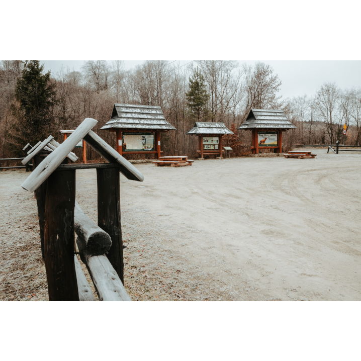 View of the educational and information boards from behind the wooden fence