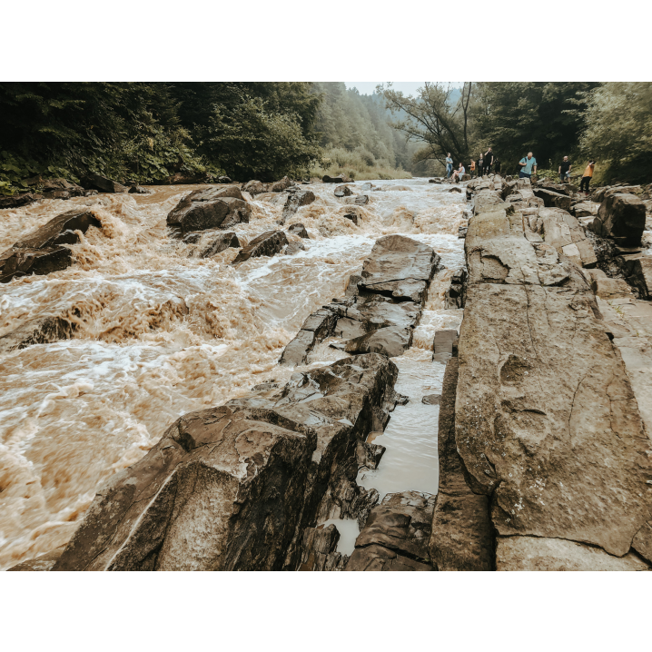 The rough current of the river hitting the stones